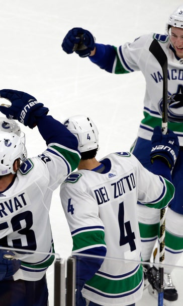 Canucks beat Bruins 8-5 for 5th straight win
